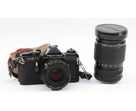 A Pentax ME film camera with a Pentax-A f/1.7 50mm lens and a Pentax-A f/3.5 35-105mm. (2) 