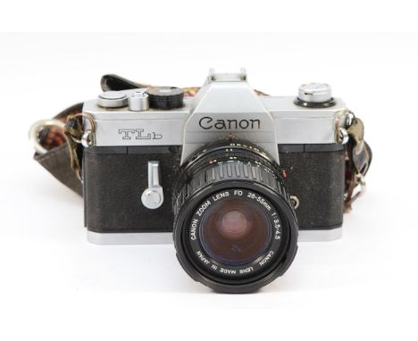 A Canon TLb film camera, with Canon f/3.5-4.5 28-55mm lens.