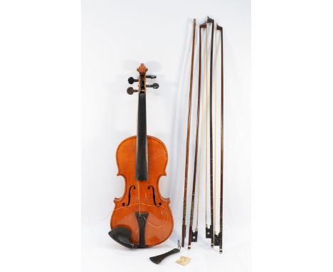 An unsigned violin, total length 58cm, with four bows decorated with Mother of Pearl, in fitted case.