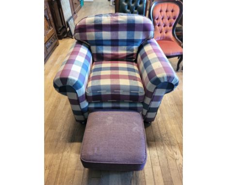 A modern armchair, upholstered in a bold chequered pattern fabric, together with a footstool, W108, D88, H94cm. (2)