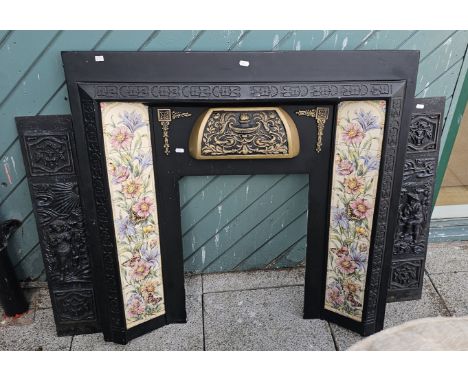 A Victorian style cast metal fire surround with tiled heath, 96 x 96cm external, 56 x 42cm internal, together with two cast m
