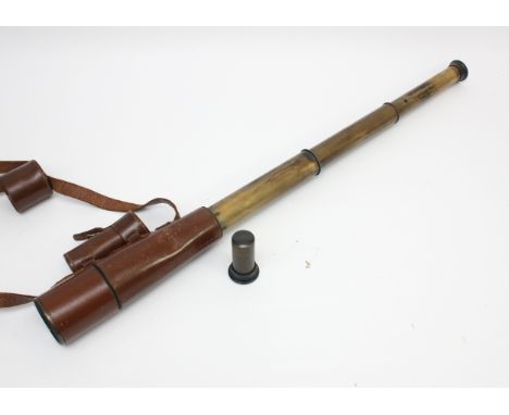 A 20th century three draw brass Signalling telescope, by Dollond London, patented 11221, with spare lens, 78cm.