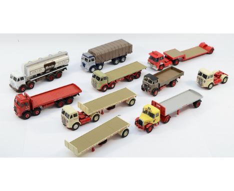 A collection of nine Corgi diecast model trucks and trailers, including ERF flatbeds, a Foden covered wagon, a Guy 'Warrior' 