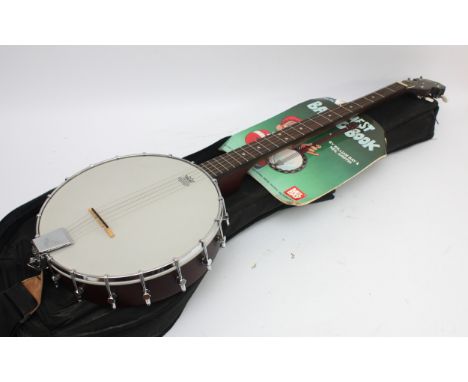 An Ozark 5-string banjo with Remo head, in fitted soft case, with Mel Bay's Easiest Banjo book.