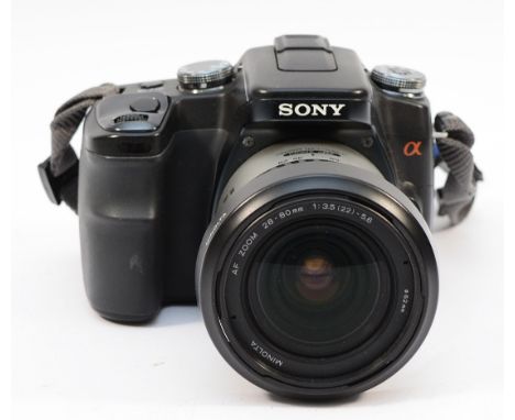 A Sony A100 digital camera, with Minolta f/3.5-5.6 28-80mm lens.
