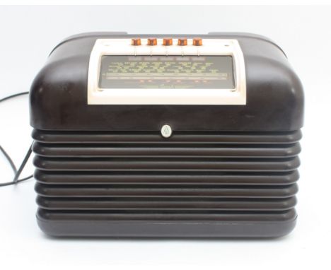 A Bush DAC10 AC/DC mains table top valve radio in mottled brown Bakelite case, Circa 1950s.