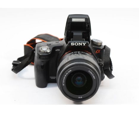 A Sony a55 digital camera with a f/3.5-5.6 18-55mm lens. 