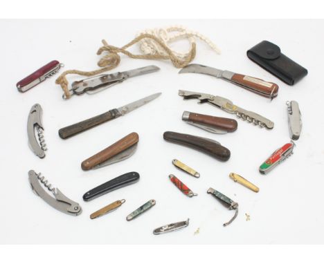 A collection of over twenty pocket pen knives, mid 20th century and later, of various styles and sizes.