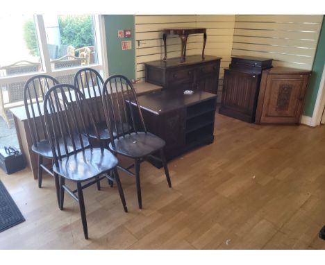 A group of seven furniture pieces, to include a set of four Ercol hooped stickback dining chairs, a modern teak effect sidebo