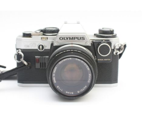 An Olympus OM-10 film camera with a Zuiko f/1.8 50mm lens. 