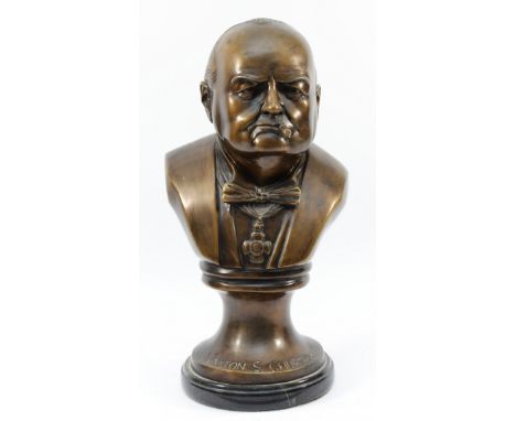 A hollow cast bronze bust of Winston S Churchill, on a veined marble socle circular base, H-33cm.