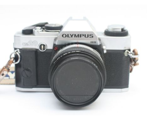 An Olympus OM20 film camera with a Zuiko Auto-S f/1.8 50mm lens, in leather case.