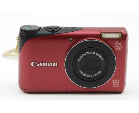 A Canon Powershot A2200 digital camera, in red.