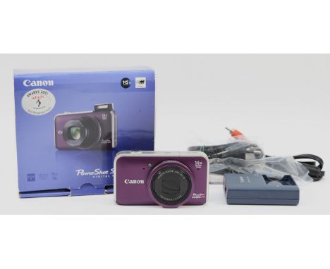 A Canon Powershot SX220 HS digital camera, boxed.