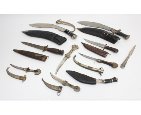 A collection of ten 20th century and later reproduction daggers to include Kukri, Jambiya and ceremonial, largest blade 28cm.