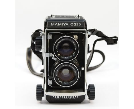 A Mamiya C220 TLR camera, with Mamiya-Sekor f/4.5 55mm lenses.Condition: There is a clear image visible through the viewfinde