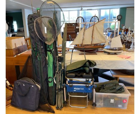A collection of course fishing equipment, to include Michigan waders, size 8, various rods, poles, nets and reels.