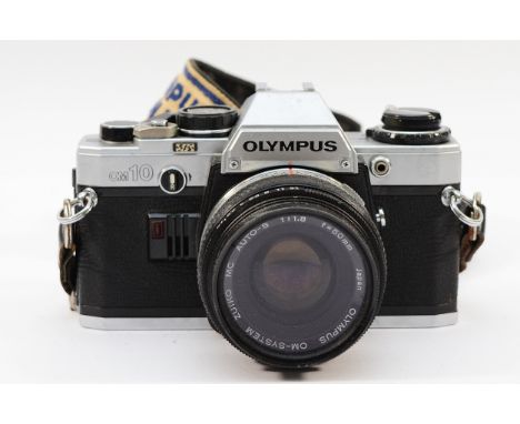 An Olympus OM10 film camera with Olympus Zuiko f/1.8 50mm lens. 