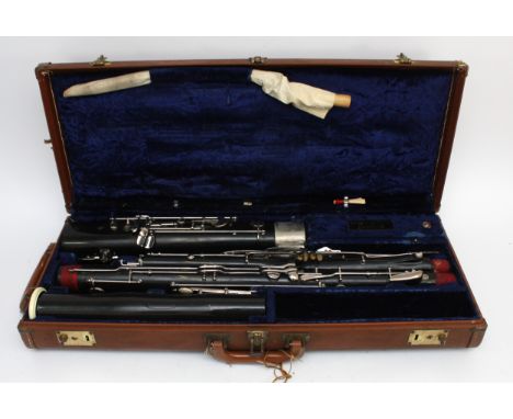A twentieth century bassoon, in four pieces, housed in velvet lined fitted case with fabric label reading 'Sanderson &amp; Ta