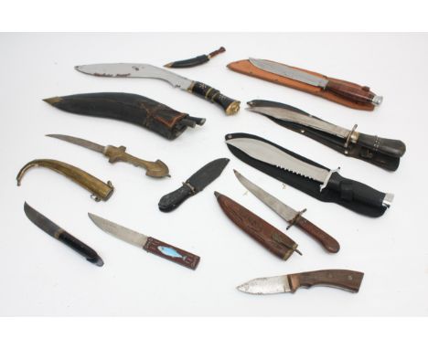 A collection of eleven 20th century and later reproduction daggers to include kukri, Jambiya and hunting knives.