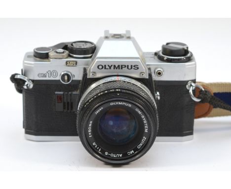 An Olympus OM10 film camera with a Zuiko f/1.8 50mm lens. 