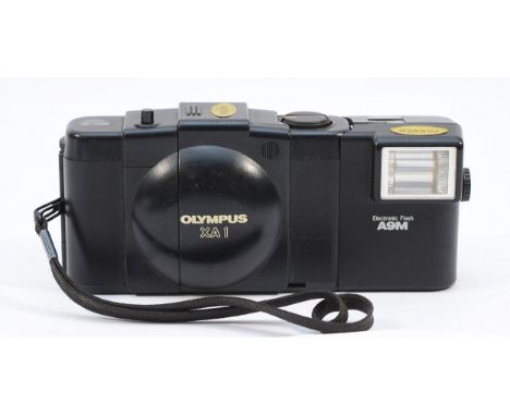 An Olympus XA1 compact film camera. 