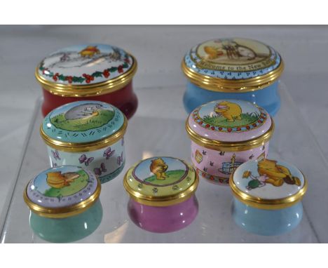 Seven Halcyon Days Disney 'Winnie the Pooh' enamel trinket boxes, the largest 4.5cm diameterSmall scratch to top of one other