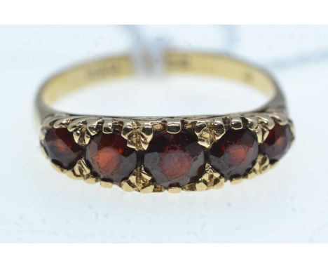 9ct gold ring set with 5 garnet coloured stones, size Q/R, 3.2 grams 