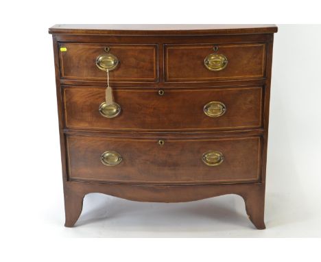 An Edwardian 2 over 2 bow front chest. With inlaid detail and crossbanded top over bracket supports. w88cm d48cm h88cm 