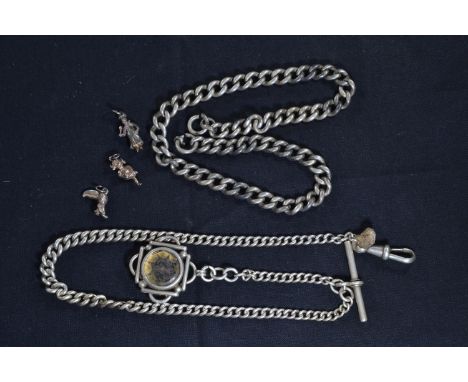 Two silver watch chains, one with compass fob, gross weight 74.15, & three white metal charms 