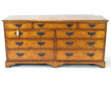 Theodore Alexander poplar burl double dresser/chest of drawers. Raised on bracket supports. w153cm d49cm h74cm 