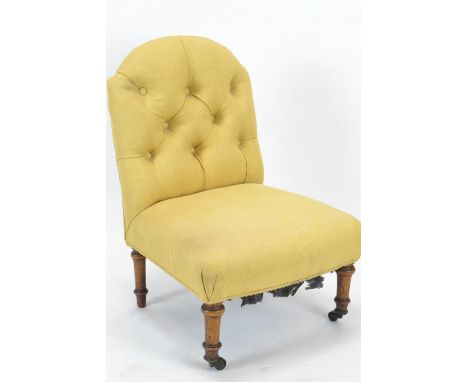 Button back bedroom chair, raised on castors 