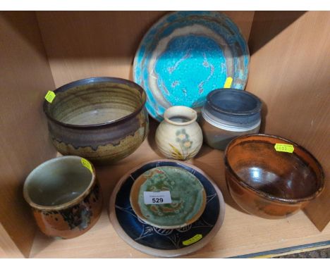 shelf of studio pottery some signed,  one chipped on rim.  