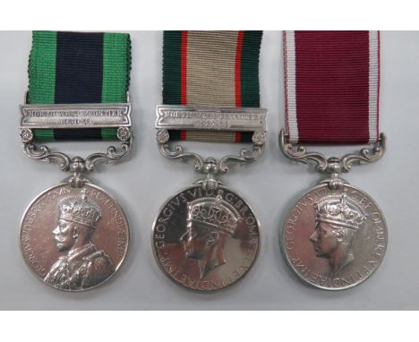 3 Various Indian Medalsconsisting India General Service GRV with bar North West Frontier 1930-31.  Named "8716 L-NK Sajawal K