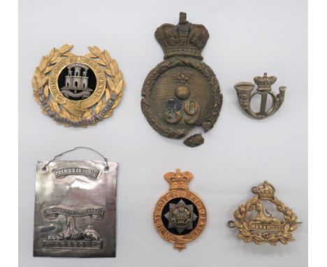 6 Various Dorsetshire Badges consisting brass 39th Foot shako plate. &nbsp;Damaged with fittings absent ... Silvered and gilt
