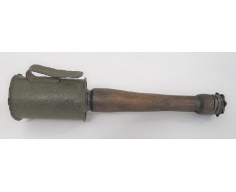 WW1 Period Inert German Stick Grenade green painted, tin canister top with side belt hook. &nbsp;Replaced wooden handle with 