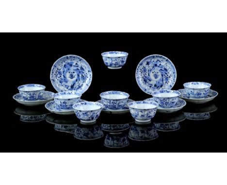 8 contoured porcelain cups and 7 saucers with blue decoration of ducks and flowers, China Kangxi period ca. 1720 (fitting/chi
