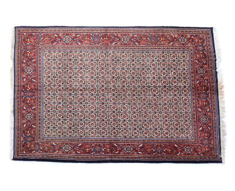 Hand-knotted wool carpet with oriental decor, 195x146 cm (some small spots of moth damage)