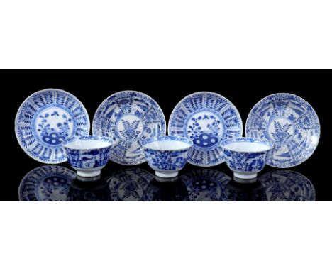 3 contoured porcelain cups and 2 saucers with blue floral decoration and landscapes 2 contoured porcelain dishes with floral 