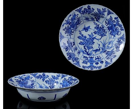 Porcelain contoured dish with high rim and blue decoration of 2 cranes in flat and around it rich floral decoration in cartou