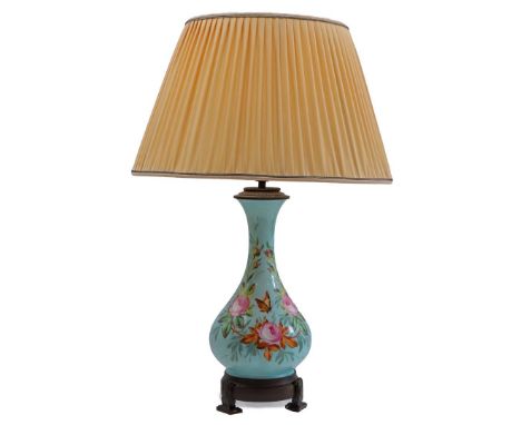 Porcelain table lamp base with painted floral decoration and butterflies, upholstered shade and copper base, 67 cm high