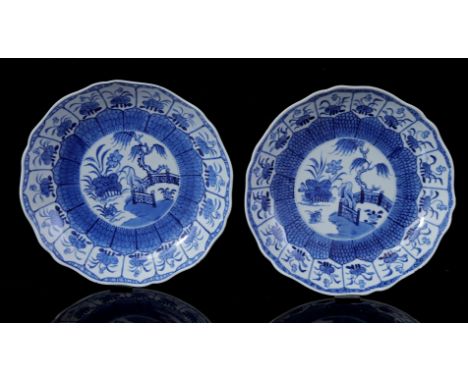 2 contoured dishes with blue lotus decoration and willow at garden gate, China Qianlong period ca. 1760, 21 cm diameter (1 di