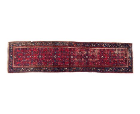 Hand-knotted wool carpet with oriental decor, 385x100 cm (moth damage on the edge)