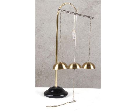 Chimes. Device to show positive and negative charge. The metal balls are positively and negatively influenced from the center