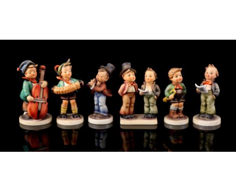 6 Goebel Hummel statues entitled "Duett Sängerpaar, number 130, 12.5 cm high, statue entitled "Zum tanz Bassgeiger/ Sweet mus