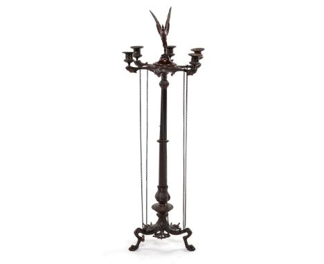 Bronze standing candlestick with 5 candle holders, 1 missing, bird on top, satyr masks under candle holders, loose hanging ch