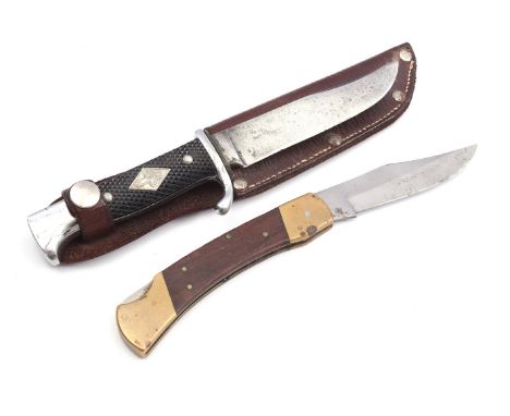 Knife with fixed blade marked "Linder Messer Solingen", with handle of Bakelite with structure and one-sided inlay with lily 