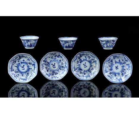 3 octagonal porcelain cup and 4 saucers with blue decoration of landscape and flowers, China Kangxi period ca. 1720 (chips/fi