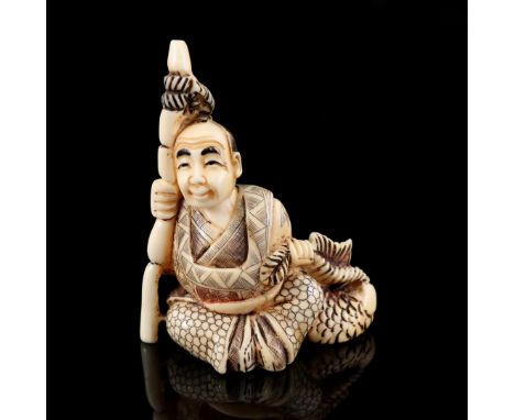 Ivory netsuke of a seated man with staff and fish, with EU certificate 24NL326102/20, Japan Taisho period ca. 1920, 6x4.7 cm 