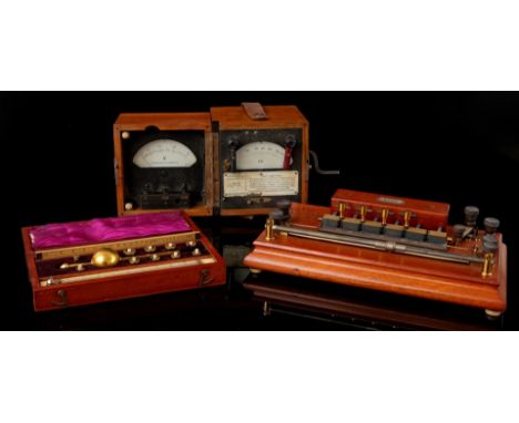 Sykes thermometer in mahogany case, Hartman &amp; Braun ammeter in walnut case and Max Kohl mahogany measuring instrument